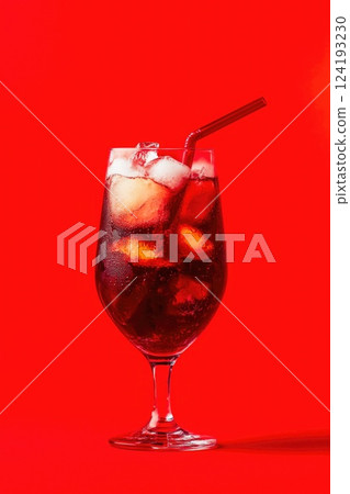 Refreshing iced cola lemonade with red straw Refreshing iced cola lemonade with red straw 124193230