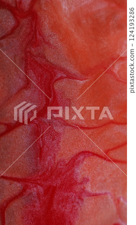 Marble texture. Sparkling liquid. Defocused red crimson color paint in water glitter fluid stream floating on abstract art background. 124193286