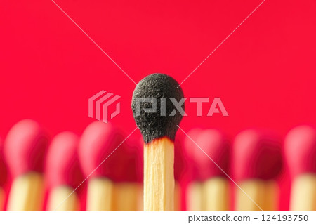 Burned-Out Match Surrounded by Fresh Matches Burned-Out Match Surrounded by Fresh Matches 124193750
