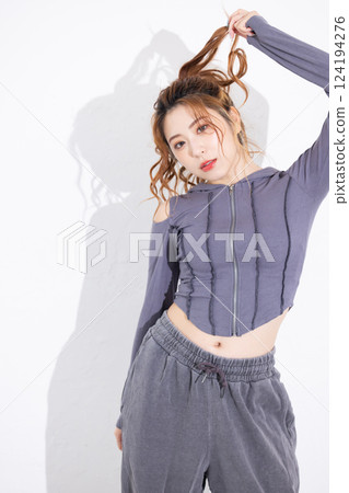 A young woman who takes a pose 124194276