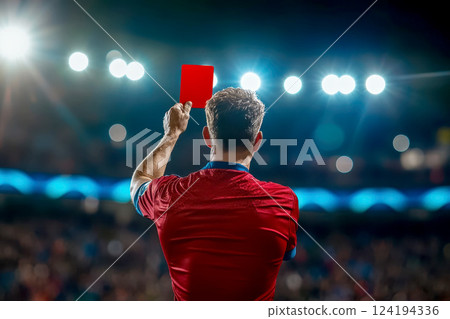 Referee showing a red card to a displeased football or soccer player while gaming. Concept of sport, rules violation, controversial issues, obstacles overcoming. 124194336