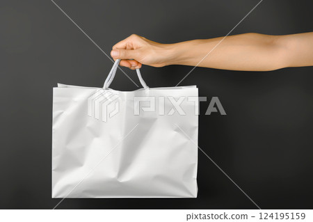 woman Hand holding white Shopping bag for mockup . AI generated image woman Hand holding white Shopping bag for mockup . AI generated image 124195159