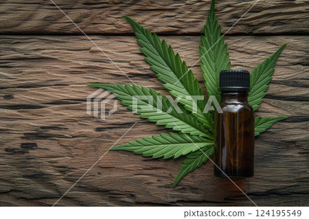 Hemp cannabis essential oil in a bottle and marijuana leaves. Generative AI, 124195549