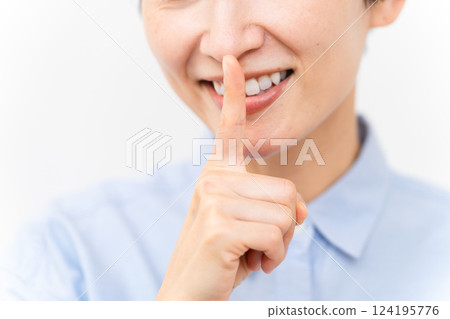 Woman wearing a long-sleeved shirt Woman wearing a long-sleeved shirt 124195776