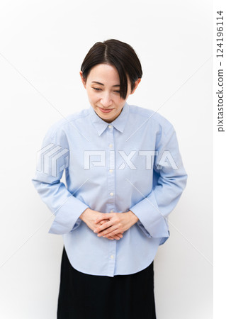 Woman wearing a long-sleeved shirt Woman wearing a long-sleeved shirt 124196114