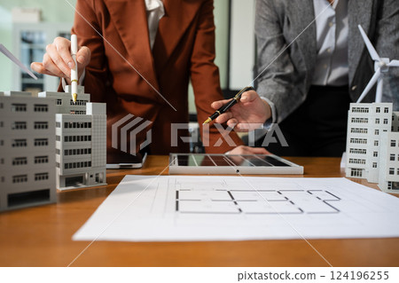 House model with agent asking costumer for contract to buy, get insurance or loan real estate or property 124196255