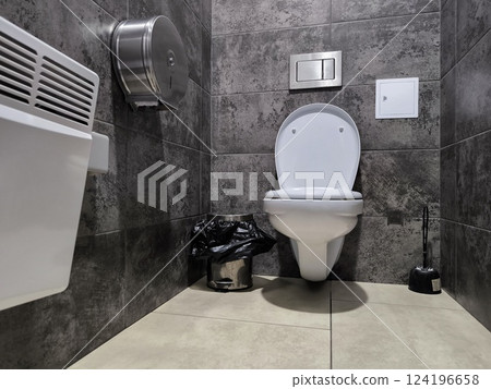 Public toilet with hand washing facilities in white and black 124196658