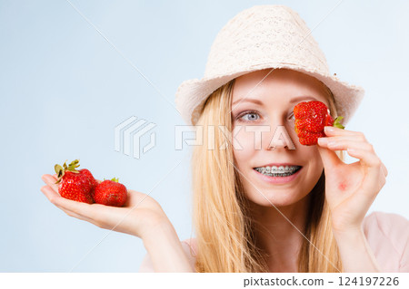 Happy woman holding strawberries 124197226