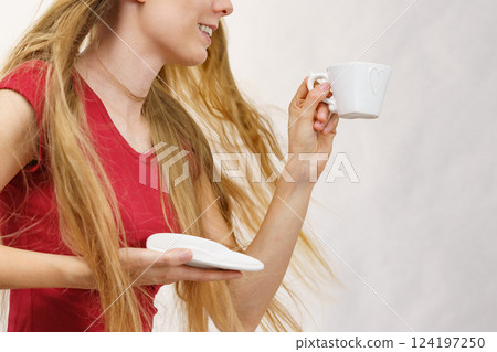 Blonde girl with coffee cup Blonde girl with coffee cup 124197250