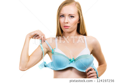 Woman choosing underwired bra 124197256