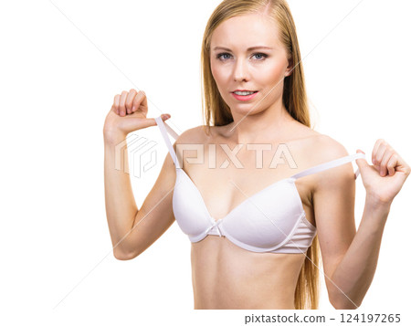 Young woman holding bra strap 124197265