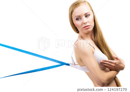 Woman wearing too big bra, loose band Woman wearing too big bra, loose band 124197270