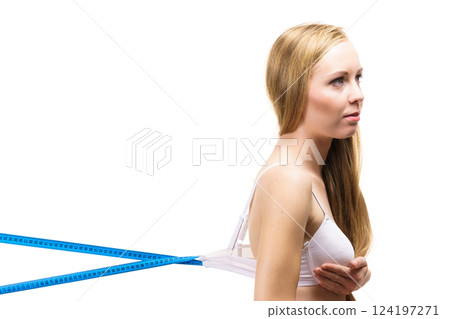 Woman wearing too big bra, loose band 124197271
