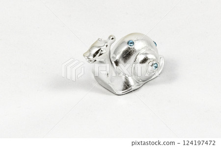 Ornamental silver snail with gemstones Ornamental silver snail with gemstones 124197472