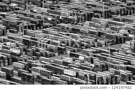 Aerial view over shipping containers stacked on a commercial port 124197482