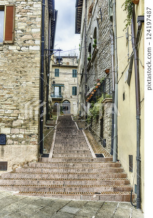 Scenic streets of the medieval town of Assisi, Umbria, Italy 124197487