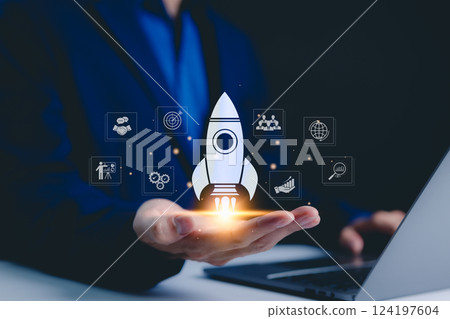 Businessman holding icons business growth and investment, Rocketing take off with a targeted launch speed, Wealth fast, Graph depicting rising earning, increasing profits exemplifies financial success 124197604