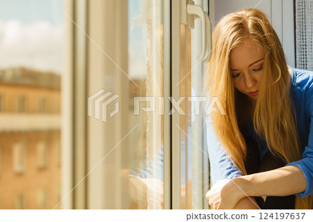 Young teenage sad woman Young teenage sad woman 124197637