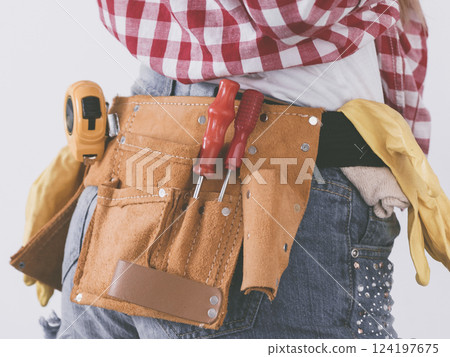 Woman wearing toolbelt 124197675