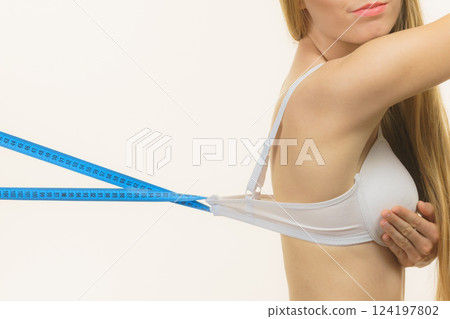 Woman wearing too big bra, loose band 124197802