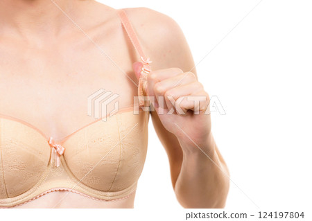 Woman wearing wrong size bra Woman wearing wrong size bra 124197804