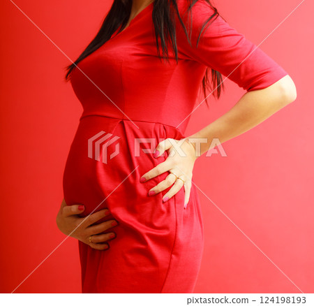 Closeup on tummy of pregnant woman 124198193