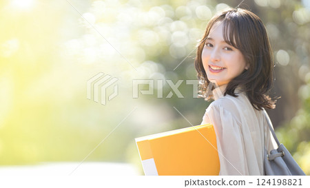 Female college student walking on campus Female college student walking on campus 124198821