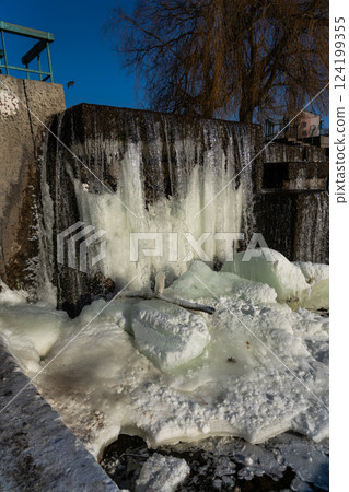 Frozen waterfall water. A frozen waterfall on a February morning 124199355