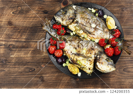 Two delicious whole baked fish. 124200355