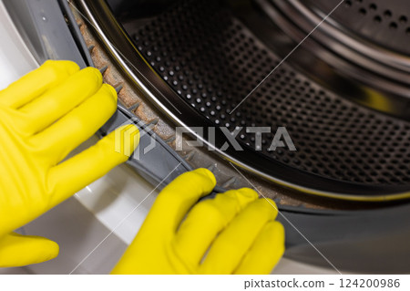 Mold, dirt and limescale in washing machine. Close up. 124200986