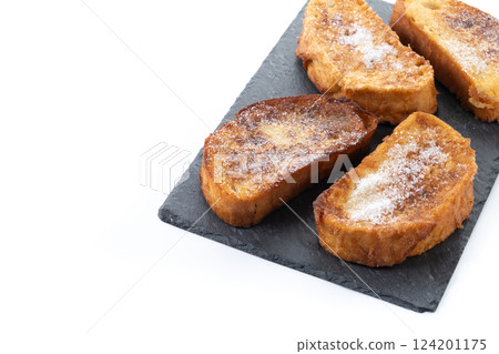 Traditional Spanish torrijas for Holy Week isolated on white background Traditional Spanish torrijas for Holy Week isolated on white background 124201175