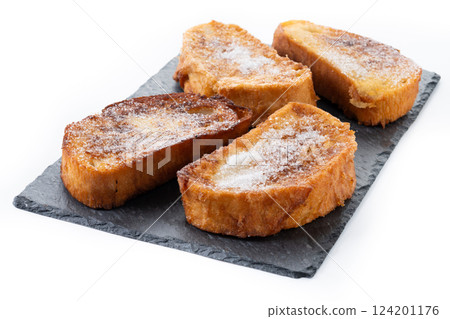 Traditional Spanish torrijas for Holy Week isolated on white background Traditional Spanish torrijas for Holy Week isolated on white background 124201176
