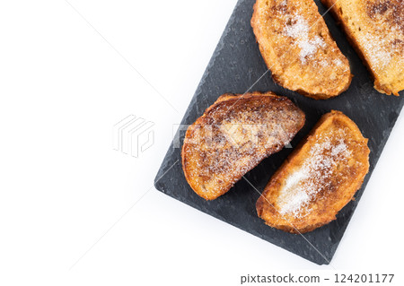 Traditional Spanish torrijas for Holy Week isolated on white background Traditional Spanish torrijas for Holy Week isolated on white background 124201177