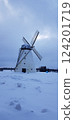 Working windmill on winter field 124201719