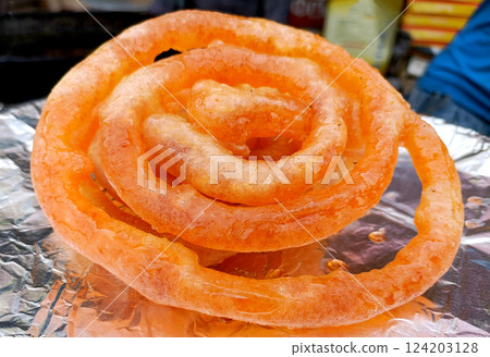 A jalebi on a plate 124203128