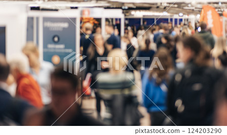 Abstract blurred people at exhibition hall of expo event trade show. Business convention show or job fair. Business concept background Abstract blurred people at exhibition hall of expo event trade show. Business convention show or job fair. Business concept background 124203290