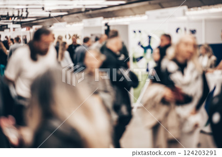 Abstract blurred people at exhibition hall of expo event trade show. Business convention show or job fair. Business concept background Abstract blurred people at exhibition hall of expo event trade show. Business convention show or job fair. Business concept background 124203291
