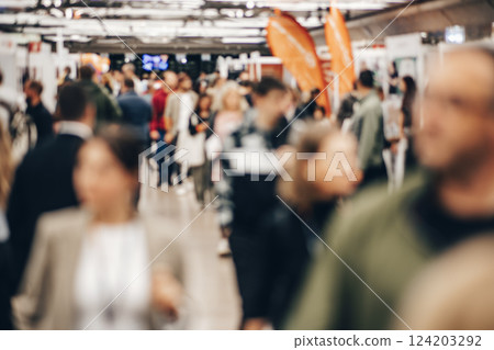 Abstract blurred people at exhibition hall of expo event trade show. Business convention show or job fair. Business concept background Abstract blurred people at exhibition hall of expo event trade show. Business convention show or job fair. Business concept background 124203292