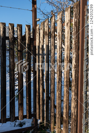 Rustic old wooden fence, detail. 124203299