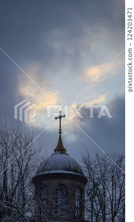 Blue sky with clouds, winter weather. Clouds on the background of trees. 124203471
