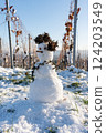 Snowman on a beautiful sunny day. 124203549