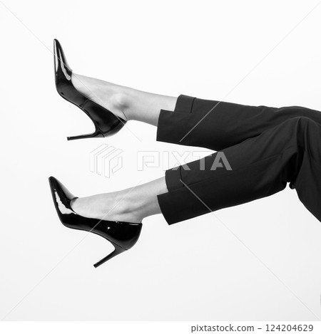 Woman legs with high heel black shoes and trousers Woman legs with high heel black shoes and trousers 124204629