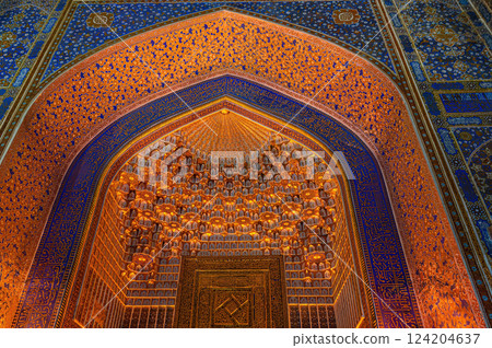 Colourful gold painting of arches and domes of Tilla-Kari Madrasah. Samarkand, Uzbekistan. 124204637