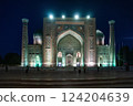Sherdor Madrasah on Registan Square with festive evening color lighting in Samarkand, Uzbekistan. 124204639