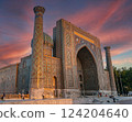 Sherdor Madrasah in the sunset. Beautiful sky with clouds. Registan Square in Samarkand, Uzbekistan. 124204640