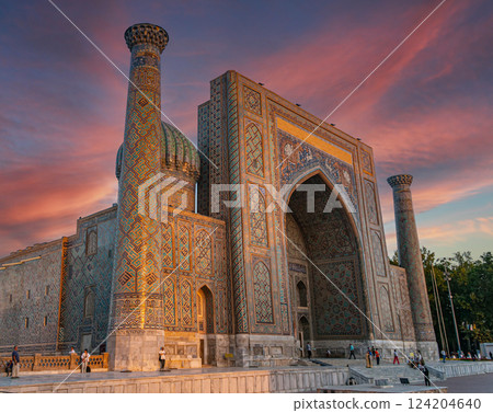 Sherdor Madrasah in the sunset. Beautiful sky with clouds. Registan Square in Samarkand, Uzbekistan. 124204640