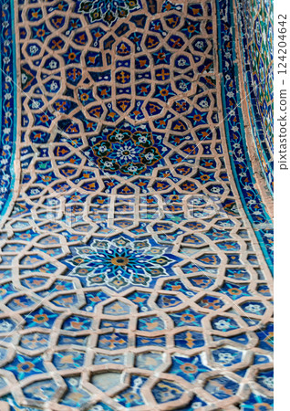 Majolica tile pattern on a madrasah. Samarkand, Uzbekistan. An example of the art of Central Asia. 124204642