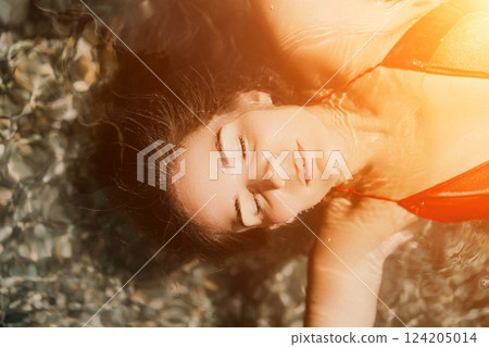 Happy woman sea relaxing floating in transparent sea water on summer holiday. Travel leisure recreation lifestyle, female in nature. Happy woman sea relaxing floating in transparent sea water on summer holiday. Travel leisure recreation lifestyle, female in nature. 124205014