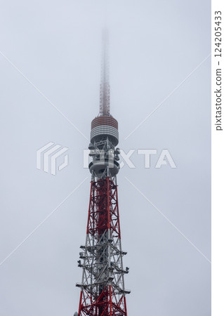 Tokyo Tower partially obscured by thick fog softens its steel structure 124205433