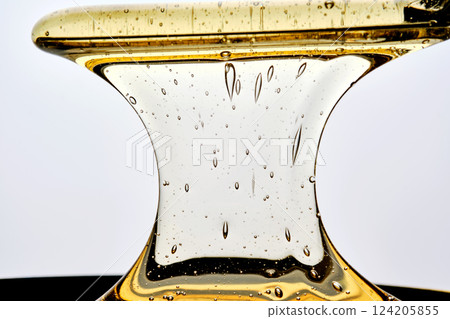 Photo of a sugar paste for depilation hair removal procedure. Texture. 124205855